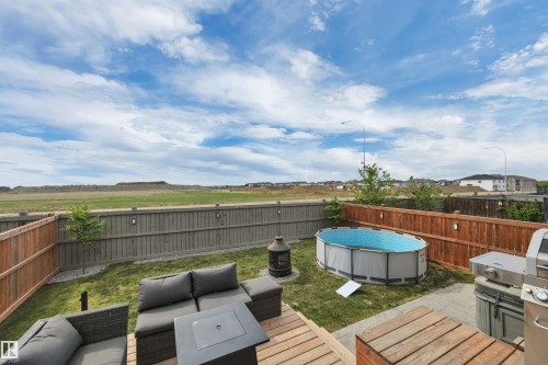 548 Reynalds Wynd, Leduc, AB - Outdoor With Above Ground Pool With Deck Patio Veranda