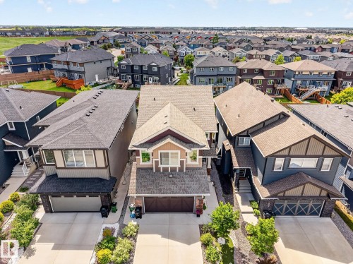 Modern two-story residence with a multi-gabled roofline and a neutral color palette - 2534 Wonnacott Loop, Edmonton, AB 