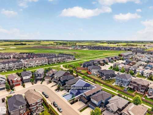 Aerial view of a residential neighborhood with green spaces - 2534 Wonnacott Loop, Edmonton, AB 