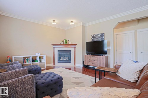 240 Henderson Link, Spruce Grove, AB - Indoor Photo Showing Living Room With Fireplace