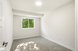 Room featuring light gray carpet, white walls, and a recessed ceiling light - 