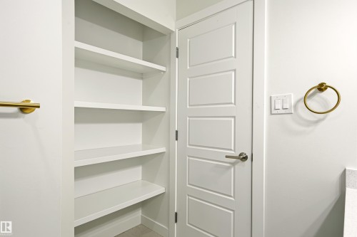 Built-in open shelving with multiple tiers provides ample storage - 18217 84 Avenue Nw, Edmonton, AB 