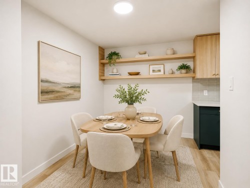 Dining area featuring wood-finish flooring, two tiers of built-in open shelving, light wood cabinetry, and a subway tile backsplash - 18217 84 Avenue Nw, Edmonton, AB 