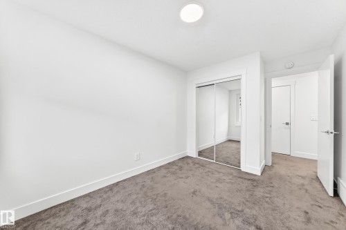 Neutral-toned carpeting paired with white walls - 17 4137 76 Street, Edmonton, AB 