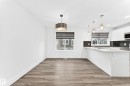 Bright interior featuring wood-finish flooring and white walls - 17 4137 76 Street, Edmonton, AB 