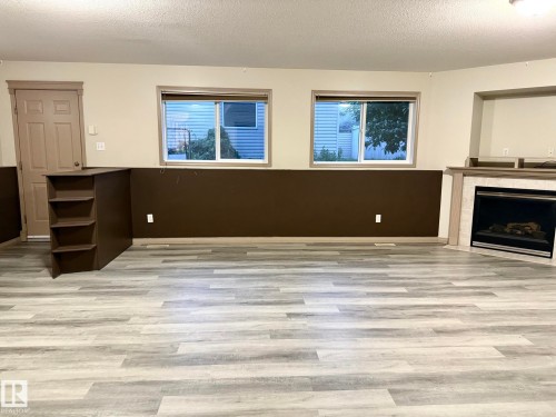 Spacious room with light wood-finish flooring - 1978 Tomlinson Green Green, Edmonton, AB 