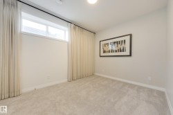 Neutral-toned walls complemented by light-colored carpeting - 