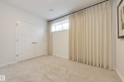 Light-colored wall-to-wall carpeting throughout - 