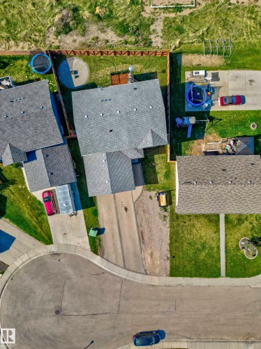 Property featuring a multi-gabled roofline and an attached garage - 4804 64 Avenue, Cold Lake, AB 