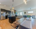 Open-concept living space featuring wood-finish flooring throughout - 4804 64 Avenue, Cold Lake, AB 
