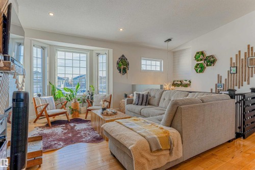 Living area featuring a prominent bay window with multiple panes - 4804 64 Avenue, Cold Lake, AB 