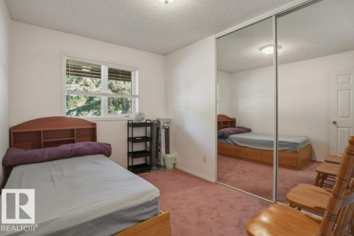 Bedroom with light-colored walls and pink carpeting - 8901 94 Avenue, Fort Saskatchewan, AB 