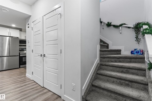 Contemporary interior featuring light-toned wood-finish flooring - 8046 Kiriak Link, Edmonton, AB - Indoor Photo Showing Other Room
