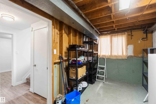 Lower level featuring exposed ceiling joists and a concrete floor - 3312 106 Avenue, Edmonton, AB 