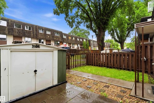 Private fenced yard featuring a storage shed - 3312 106 Avenue, Edmonton, AB 