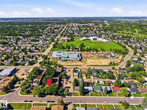 Aerial perspective showcasing a residential neighborhood with established homes and mature tree coverage - 3312 106 Avenue, Edmonton, AB 