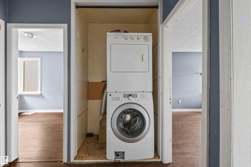 Dedicated laundry area with stacked washer and dryer unit - 7520 106 Street, Edmonton, AB 