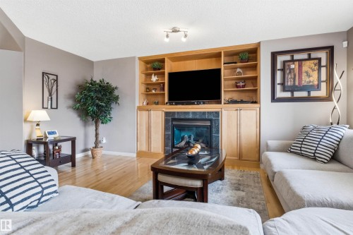 7307 Singer Way, Edmonton, AB - Indoor Photo Showing Living Room With Fireplace