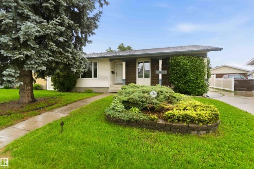 Single-story residence featuring light-colored siding and brick accents - 17303 107 Street, Edmonton, AB 
