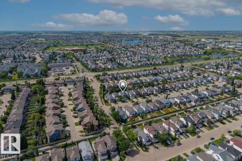 Aerial perspective showcasing a residential neighborhood with varied architectural styles and mature landscaping - 8509 7 Avenue, Edmonton, AB 