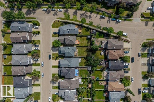 Aerial overview showcasing a residential neighborhood with multiple detached homes - 8509 7 Avenue, Edmonton, AB 