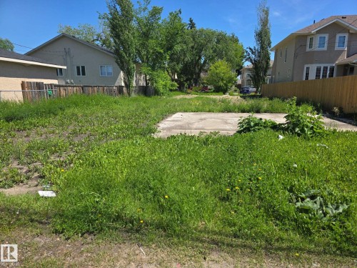 Expansive lot featuring a concrete pad and established perimeter fencing - 11726 122 Street Nw, Edmonton, AB 