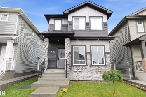 Modern two-storey with vinyl siding and stone accents - 6084 179 Avenue, Edmonton, AB 