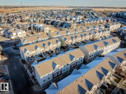Aerial perspective showcasing a developed residential area with row housing - 