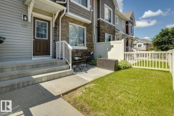 Exterior showcasing horizontal siding and stone veneer accents - 