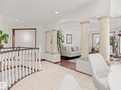 Corridor with tile patterned floors and recessed lighting - 