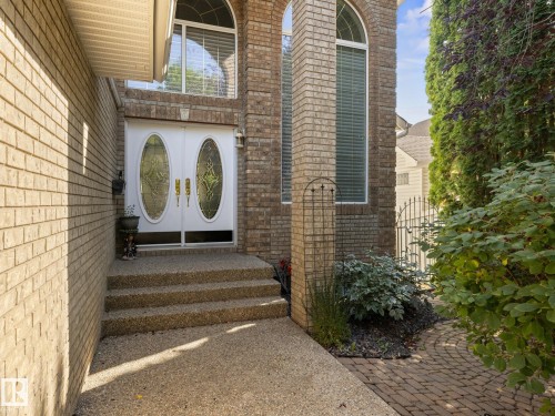 Doorway to property with brick siding, a gate, and french doors - 29 Oakdale Place, St. Albert, AB 