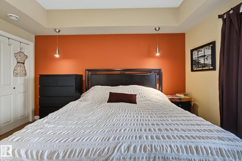 Bedroom featuring a tray ceiling with recessed lighting - 30 2565 Hanna Crescent, Edmonton, AB 