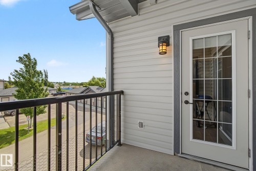 Private balcony featuring a concrete surface and black metal railing - 30 2565 Hanna Crescent, Edmonton, AB 