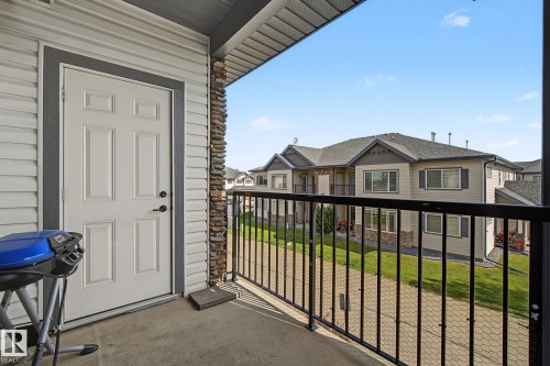Private balcony featuring a concrete surface and black metal railing - 30 2565 Hanna Crescent, Edmonton, AB 