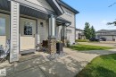 Exterior featuring light-colored siding with dark trim accents - 30 2565 Hanna Crescent, Edmonton, AB 