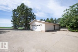 Expansive concrete driveway and parking area - 