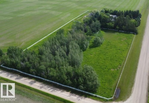 Expansive land parcel featuring open green space and mature tree lines - 26530 Twp Rd 590, Rural Westlock County, AB - Outdoor With View