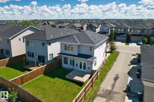 Modern two-story residence with light-colored siding and dark shingle roofing - 4673 Alwood Way, Edmonton, AB 