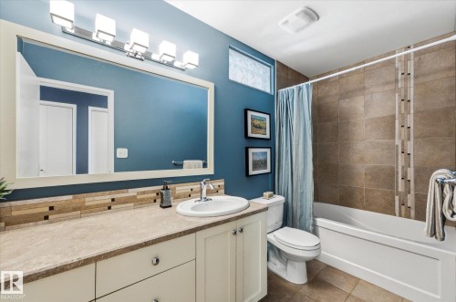 Vanity with a single basin sink and stainless steel faucet - 14309 101 Avenue, Edmonton, AB 