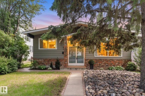 Split-level home featuring brick and horizontal siding exterior - 14309 101 Avenue, Edmonton, AB 