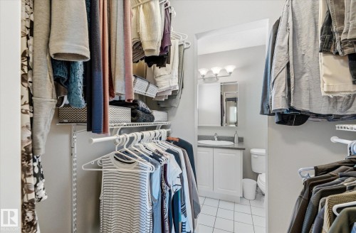 Walk-in closet featuring adjustable wire shelving and hanging rods - 14309 101 Avenue, Edmonton, AB 