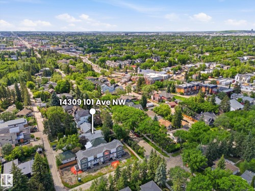 Aerial view of the property at 14309 101 Ave NW, showcasing its position within a tree-lined neighborhood - 14309 101 Avenue, Edmonton, AB 