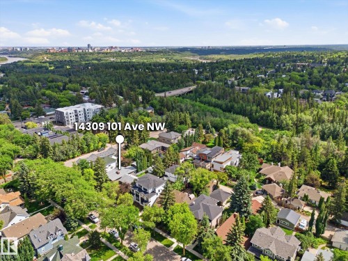 Expansive aerial perspective showcasing a residential area amidst abundant tree cover - 14309 101 Avenue, Edmonton, AB 