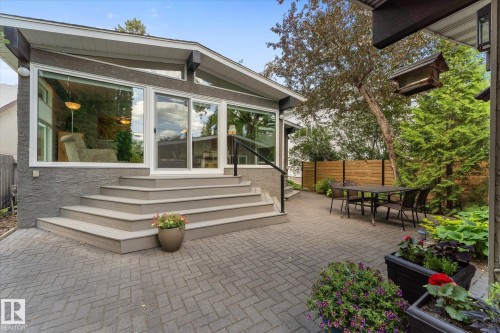 Expansive paver patio with multi-level steps leading to the home - 14309 101 Avenue, Edmonton, AB 