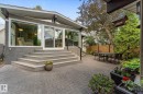 Expansive paver patio with multi-level steps leading to the home - 14309 101 Avenue, Edmonton, AB 