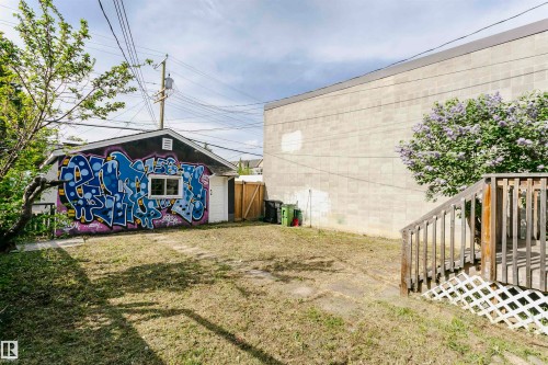 Detached single-story structure with a gabled roof and a side-entry door, featuring a single window - 10035 81 Avenue Nw, Edmonton, AB - Outdoor