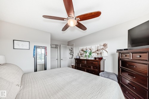 Ceiling fan with wood-finish blades - 311 142 Ebbers Boulevard, Edmonton, AB 