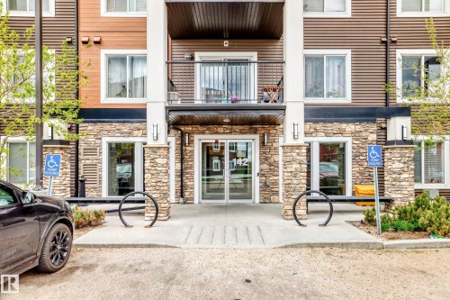 Multilevel building exterior featuring stone cladding and horizontal siding - 311 142 Ebbers Boulevard, Edmonton, AB 