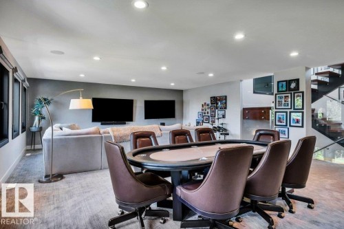 Spacious recreation room featuring recessed lighting and a large entertainment area - 8914 120 Street, Edmonton, AB 