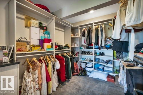 Custom closet system featuring extensive shelving and multiple hanging rods - 8914 120 Street, Edmonton, AB 
